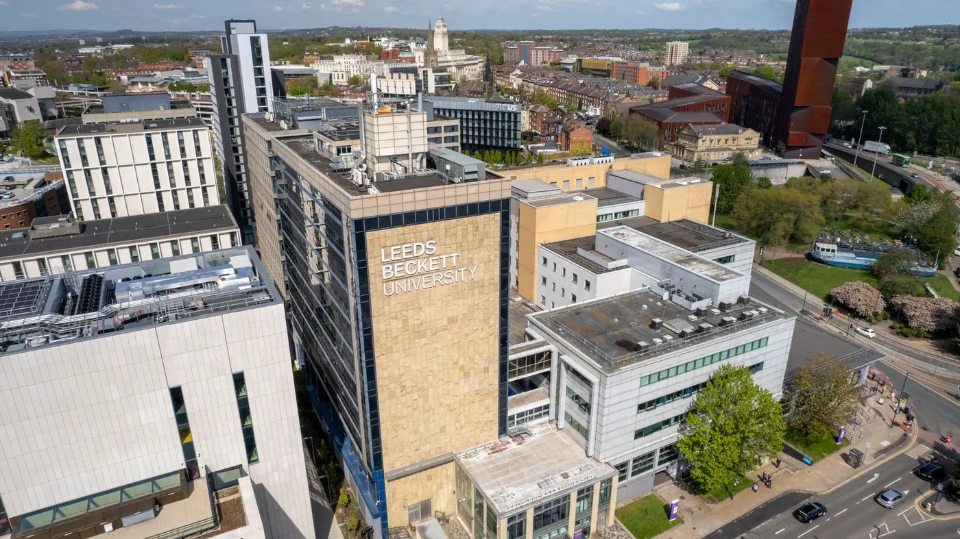 Aerial view of a UK city skyline, with Leeds Beckett University in the foreground.